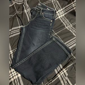 Ladies silver boot cut jeans.